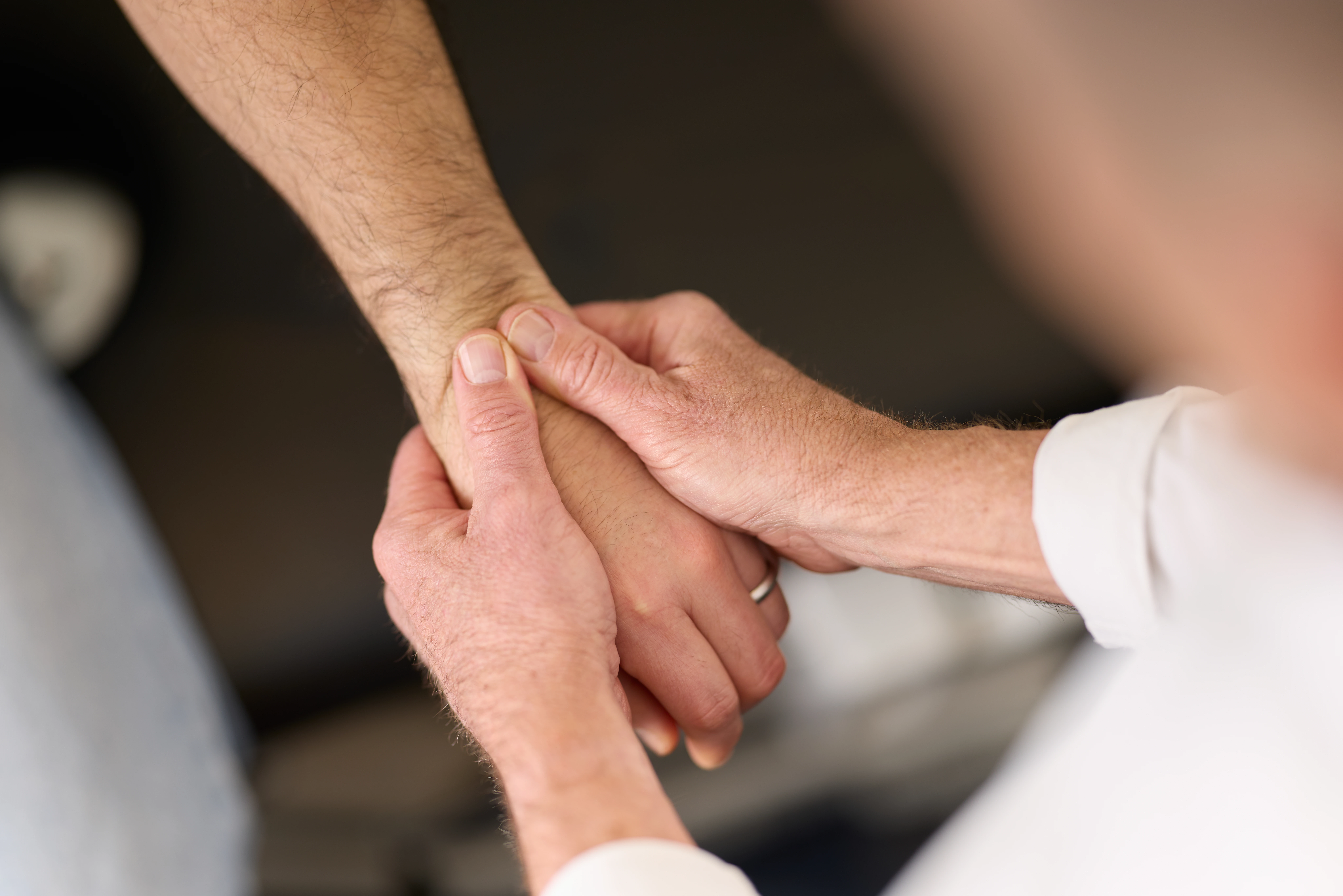 Dr Ken Leembruggen, chiropractor performing a wrist adjustment at Chiropractic Solutions Norwood Adelaide