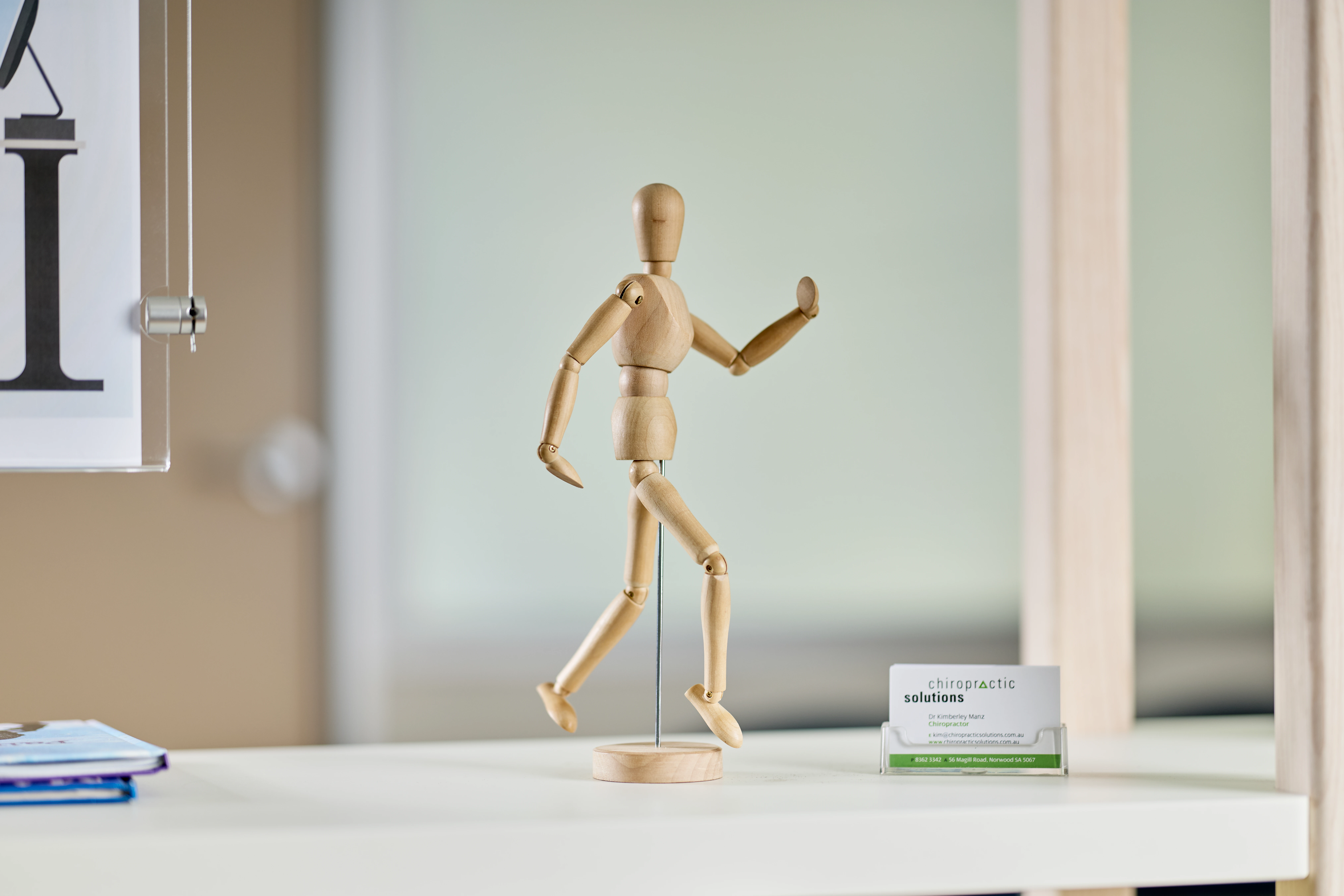 Wooden figure on display at Chiropractic Solutions Norwood Adelaide