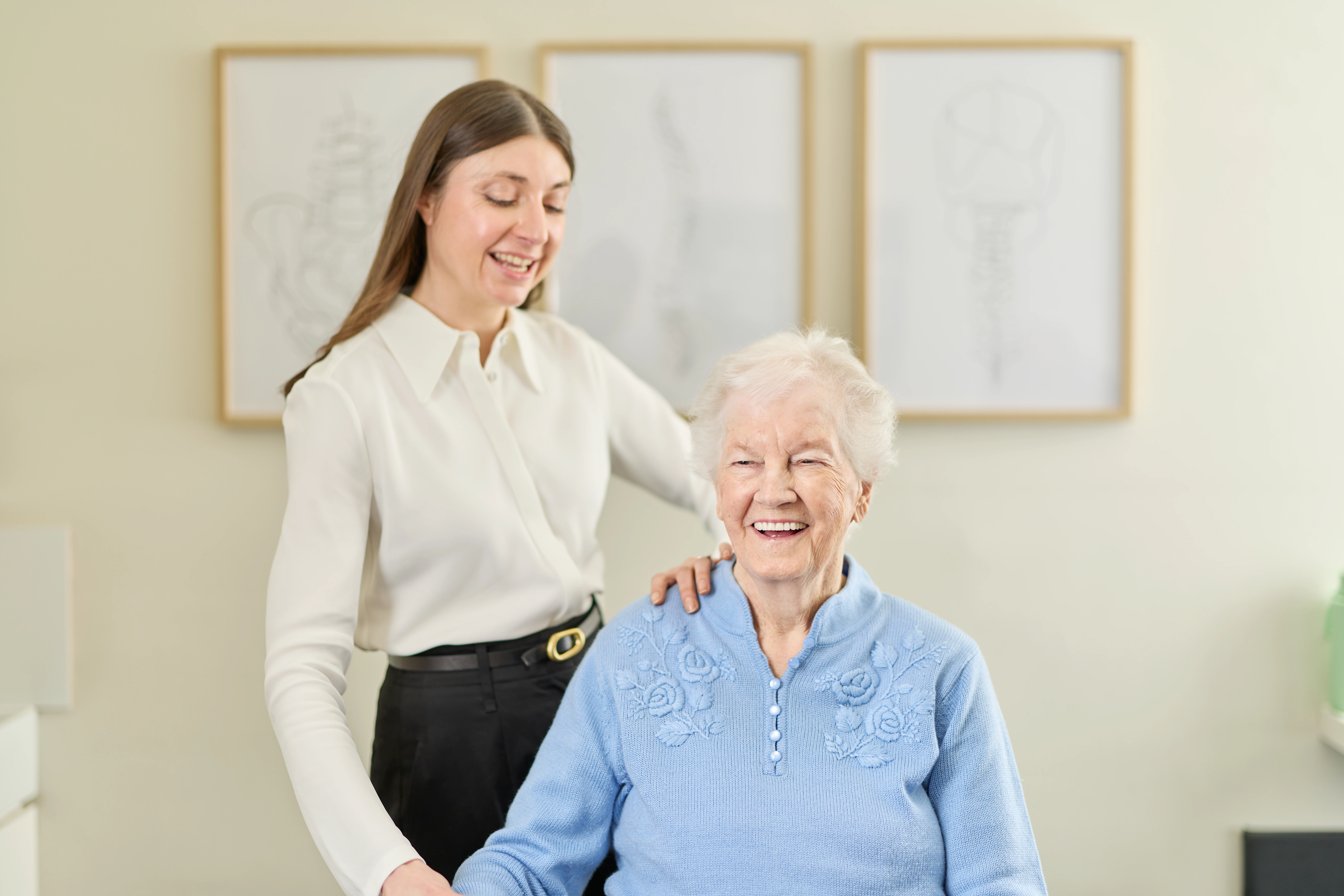 Dr Kimberley Manz, chiropractor treating an elderly female patient at Chiropractic Solutions Norwood Adelaide